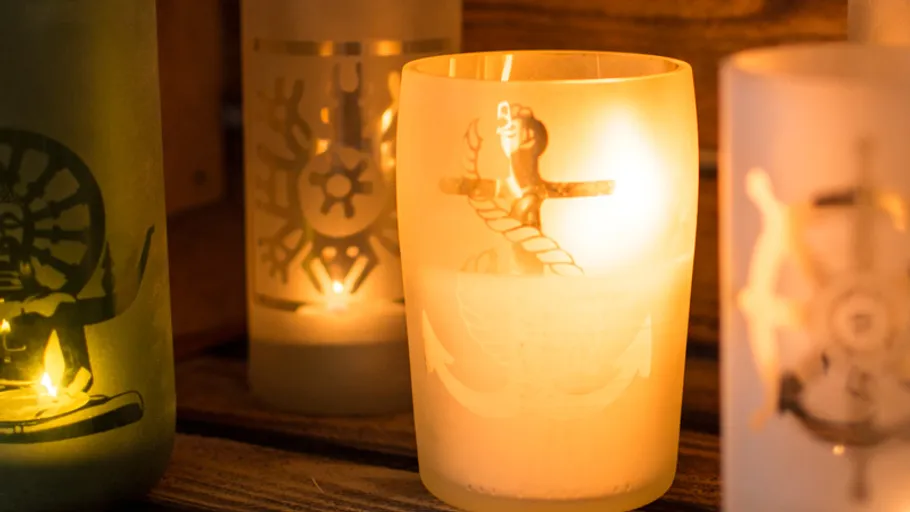 Decorative candle holders glowing warmly indoors.