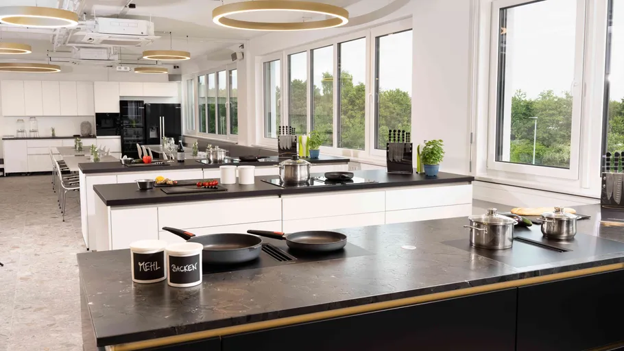 Modern kitchen with black and white decor.