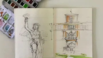 Sketchbook with statue and building drawings.
