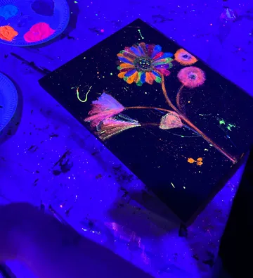 Fluorescent paint artwork under black light.