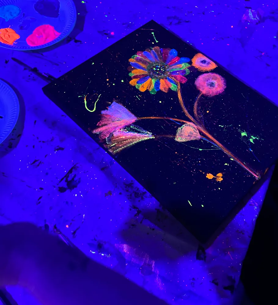 Fluorescent paint artwork under black light.
