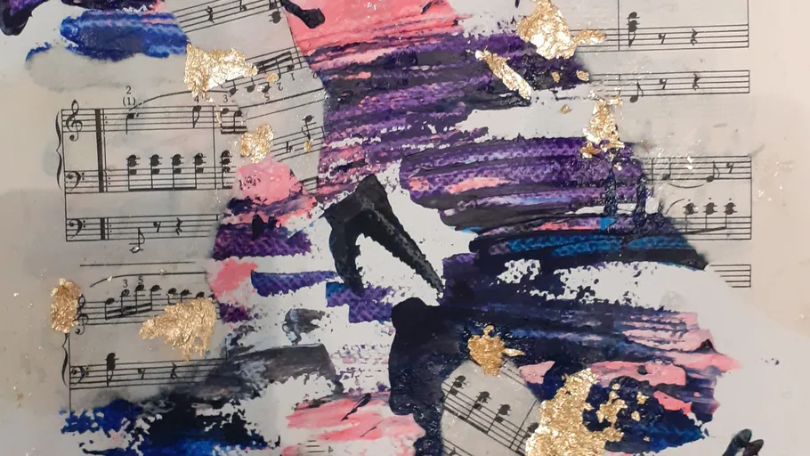 Colorful abstract painting over sheet music.