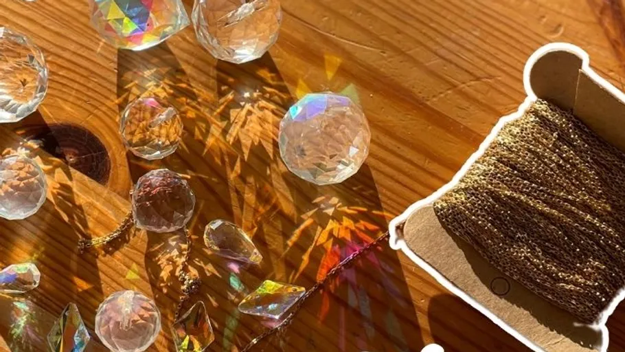 Jewelry making tools on wooden surface.