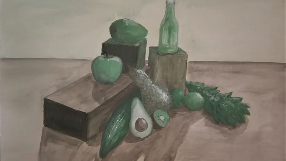 Green fruits and vegetables on wooden blocks.