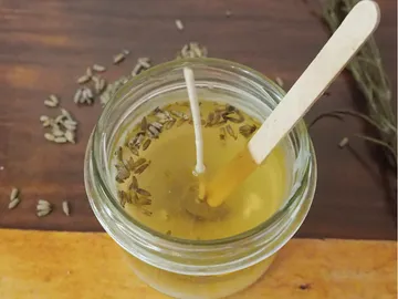 A glass with liquid wax and flavorings.
