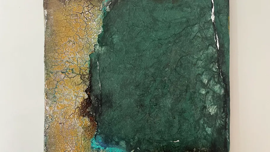 Abstract painting with green and cracked yellow surface.