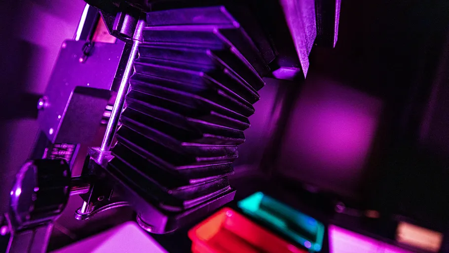 Purple-lighted camera inside a darkroom.