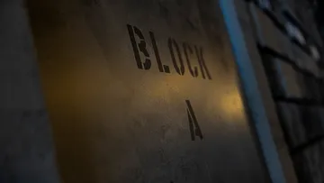Sign with text 'BLOCK A' dimly lit.
