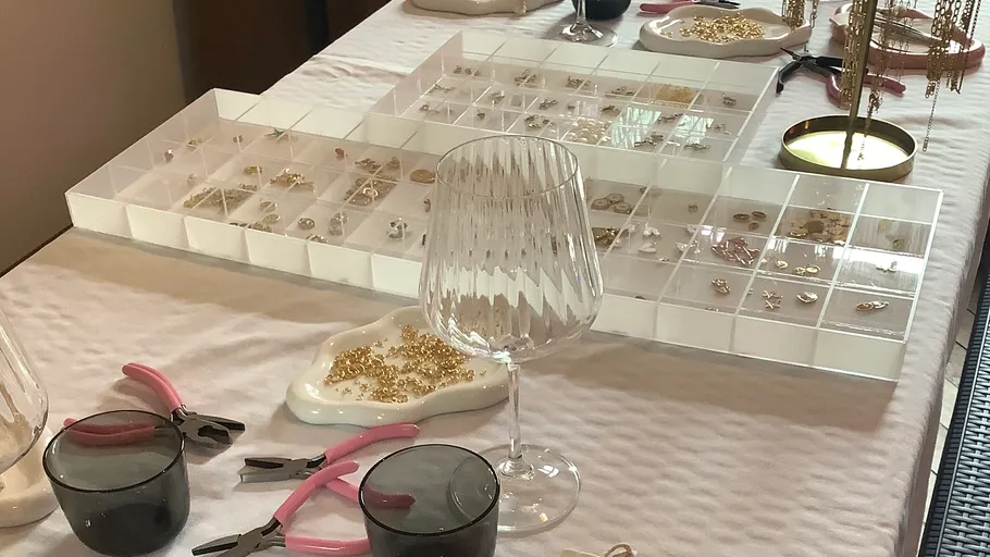 Jewelry making supplies on a table.