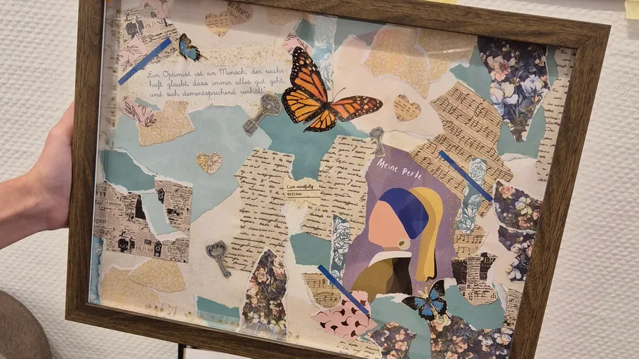 Collage with butterflies in a wooden frame.