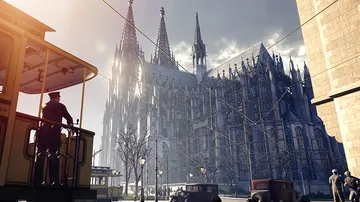 Tram passing near Gothic cathedral in city.