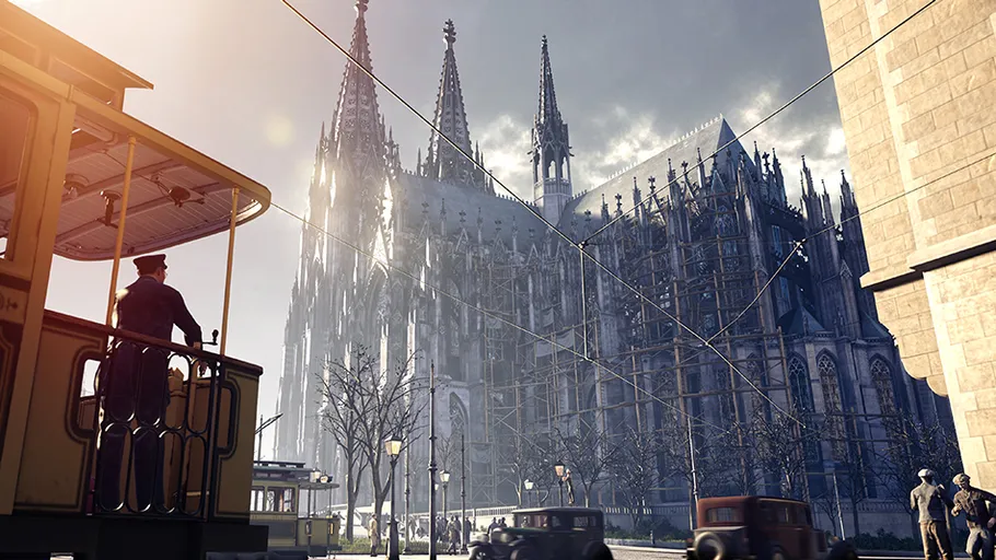 Tram passing near Gothic cathedral in city.