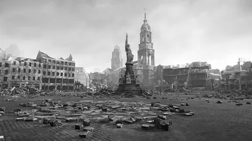 Statue stands in a war-torn city square.
