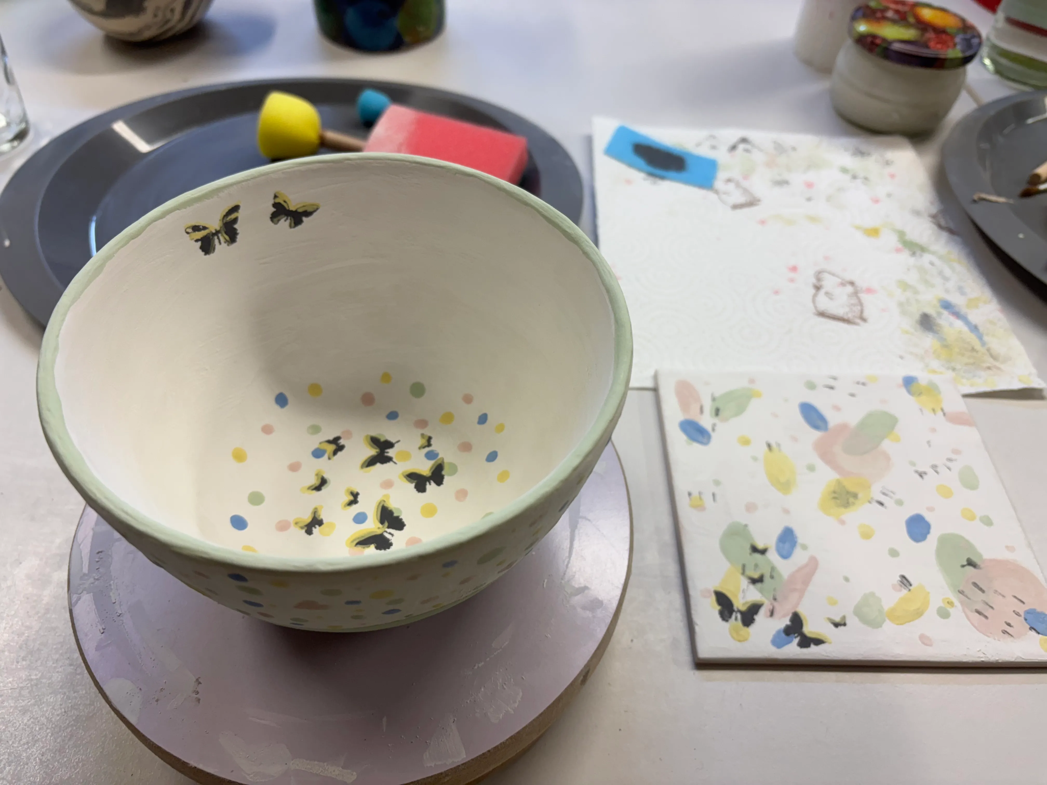 Decorated ceramic bowl with butterfly design.