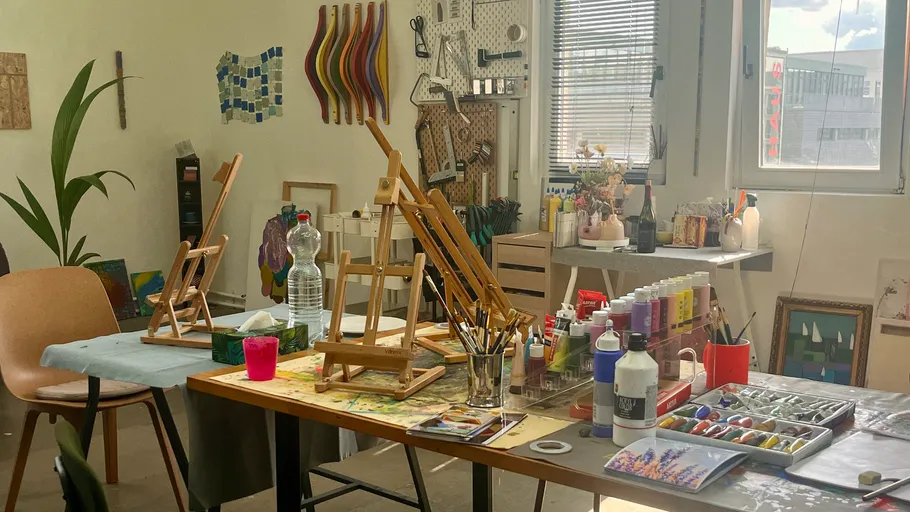 Art studio with easels and painting supplies.