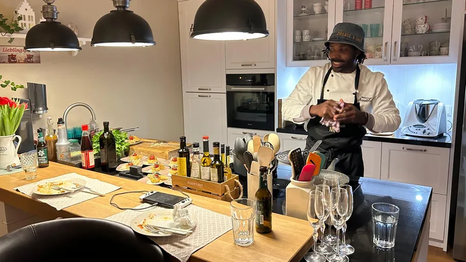Chef preparing food in a modern kitchen.