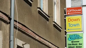 Building with colorful signs for entertainment venues.