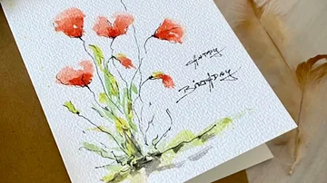 Card with red flowers and birthday message.