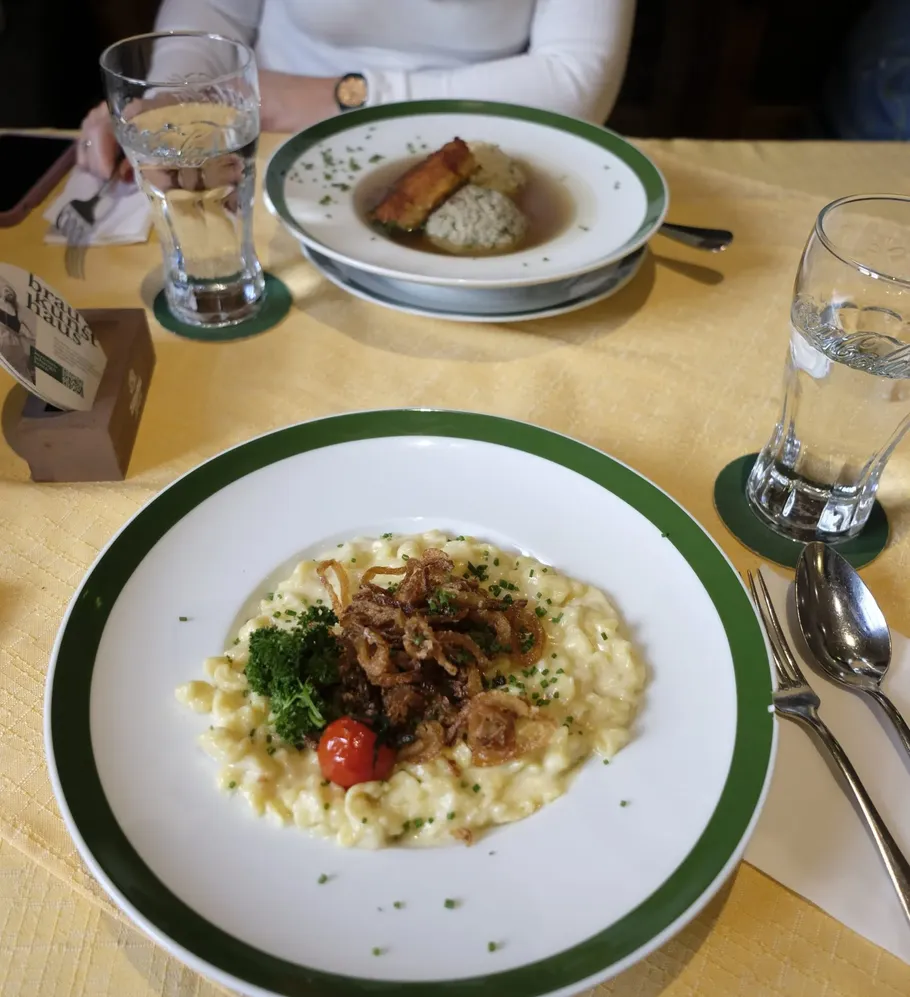 Plates with food on a restaurant table.