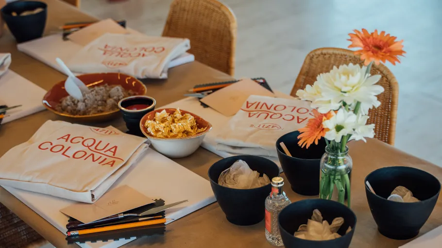 Table setting with flowers and snacks.