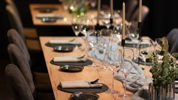 Elegantly set dining table with candles.