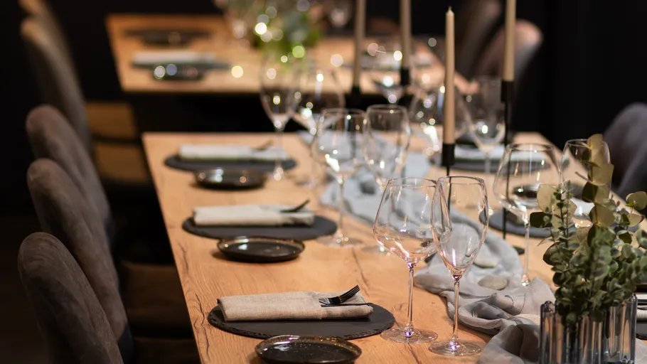 Elegantly set dining table with candles.