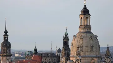 Domes and towers of a historic city skyline.