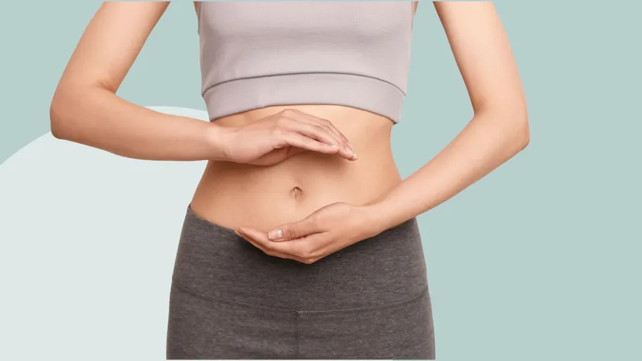 Person's stomach, hands forming a circle gesture.