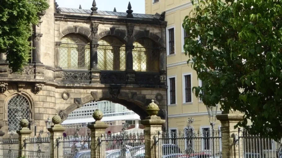 Historic bridge connecting old stone buildings.