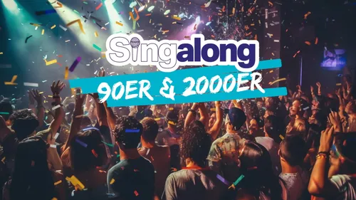 Publikum bei Konzert mit buntem Konfetti.