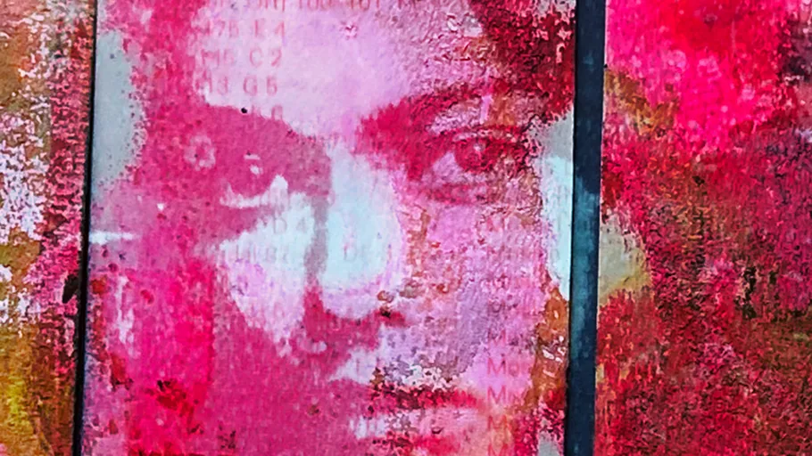 Face art overlay with red textures.