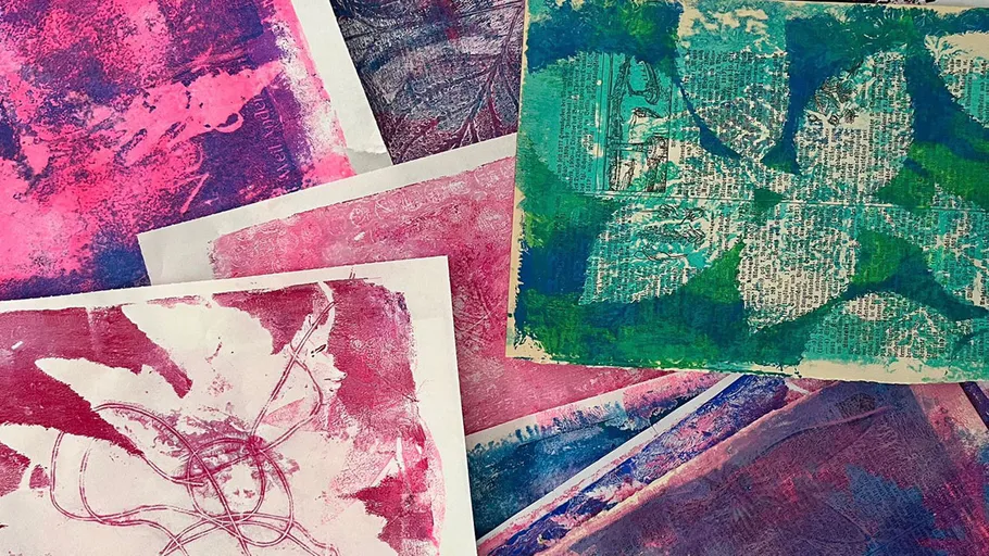 Colorful abstract prints arranged on a surface.