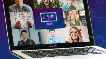 Laptop displaying video call with multiple participants.