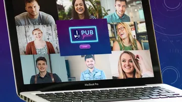 Laptop showing video call with smiling people.