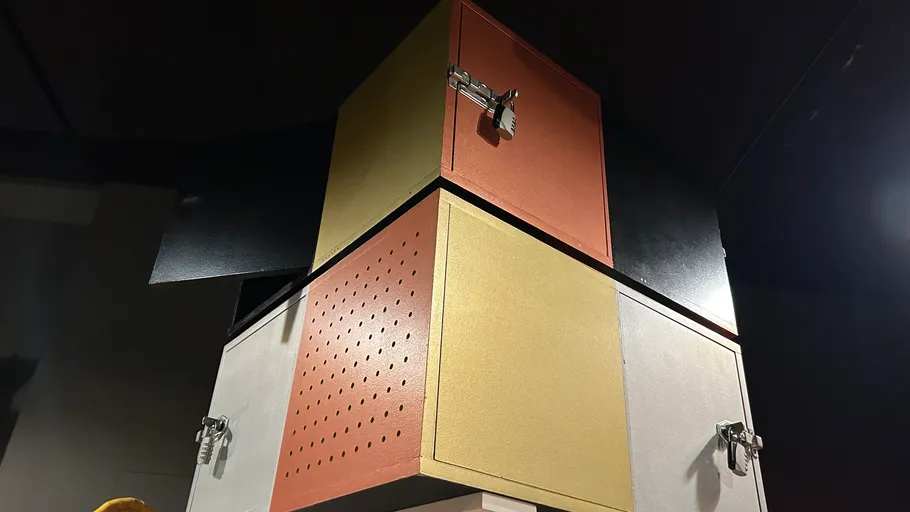 Colorful metal lockers stacked in a dark room.