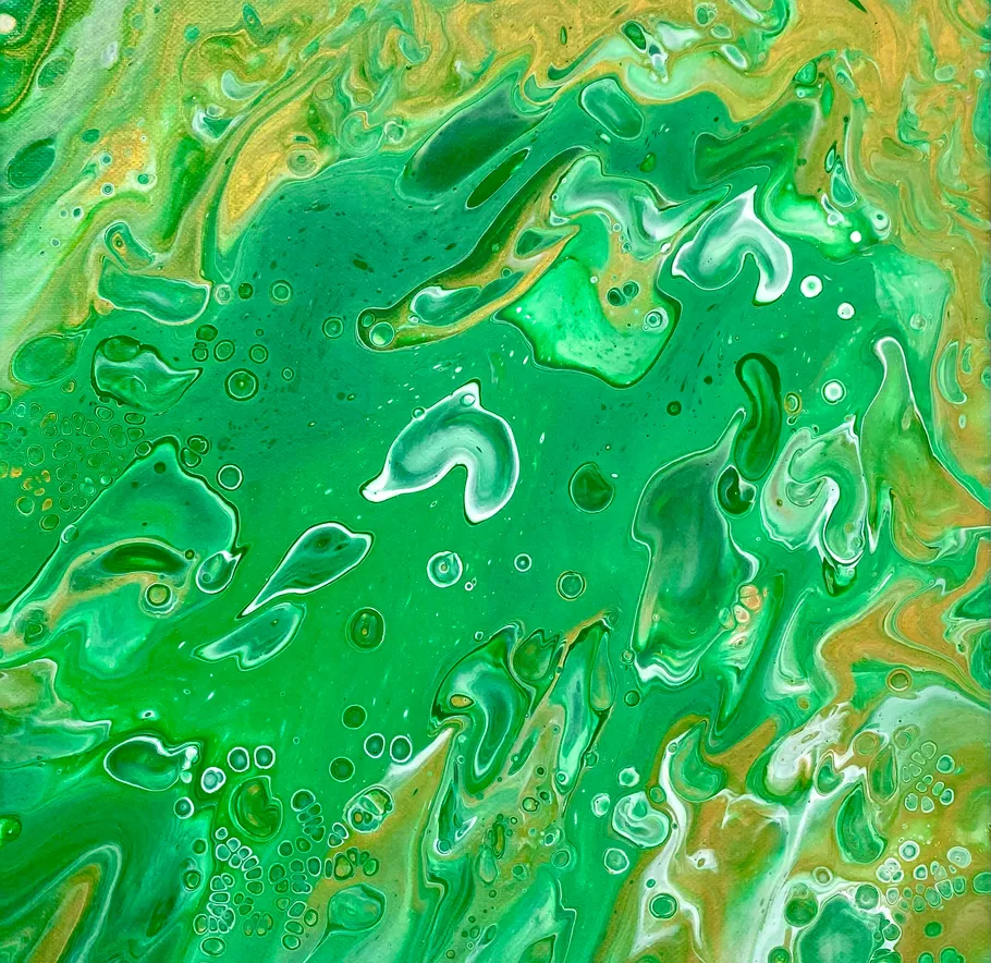 Abstract green and yellow swirling paint pattern.