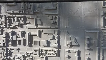 3D city map with buildings and streets.