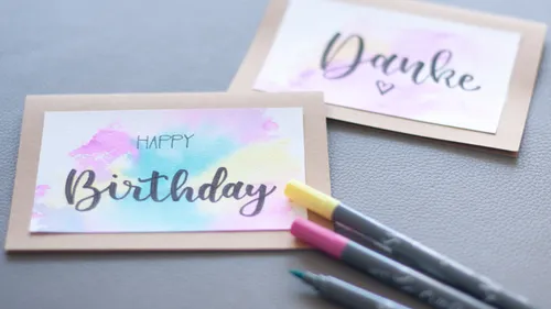 Greeting cards on table with markers.