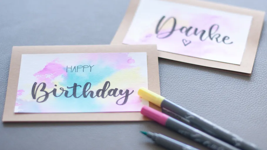 Greeting cards on table with markers.