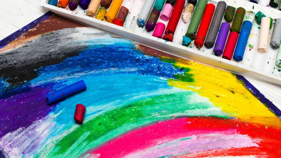 Colorful pastels on vibrant artwork background.