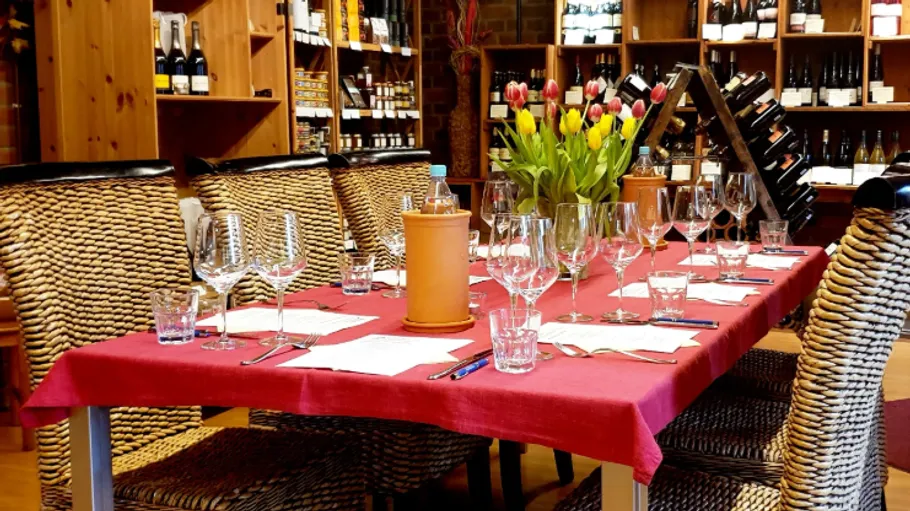 Table with glasses in a cozy wine shop.