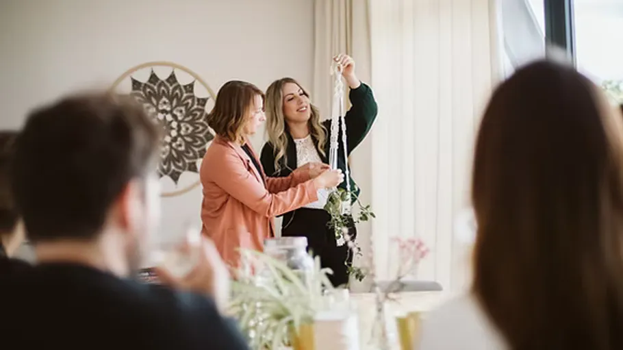 Women crafting in a cozy room setting.