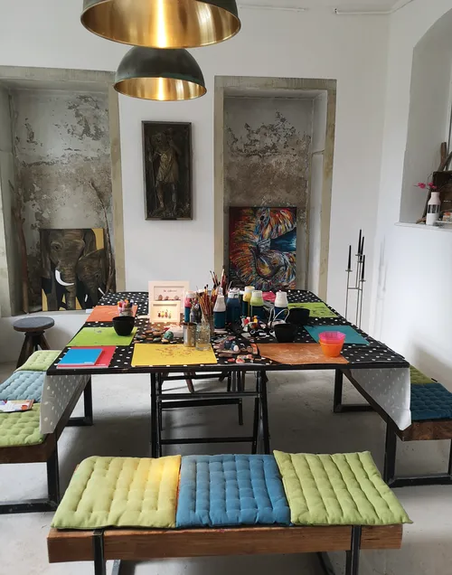 Art supplies on table in cozy room.