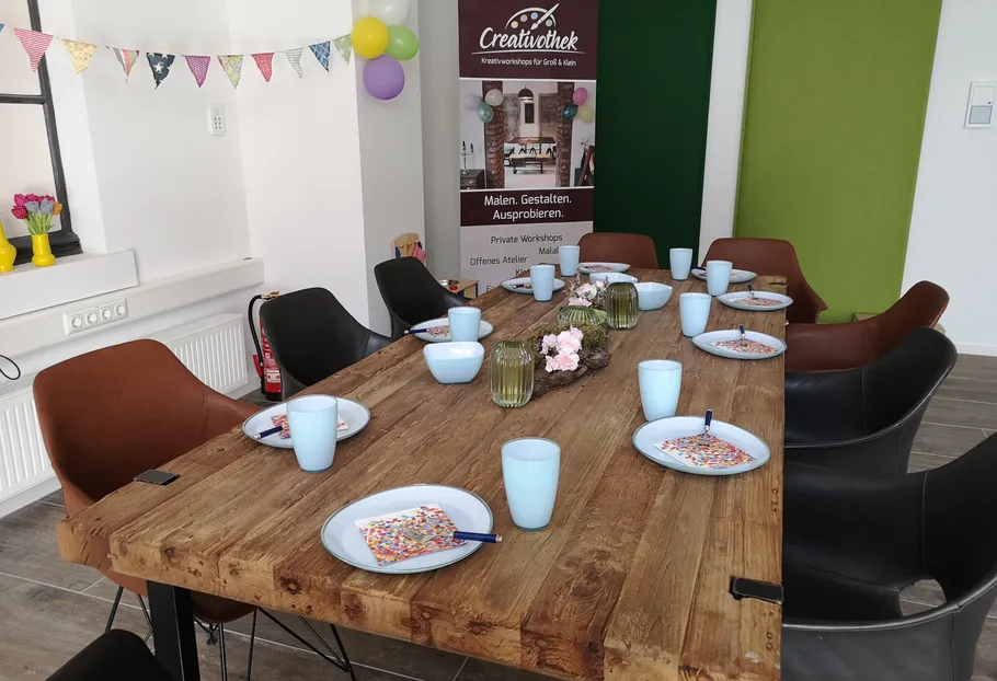 Decorated table set for a creative workshop.