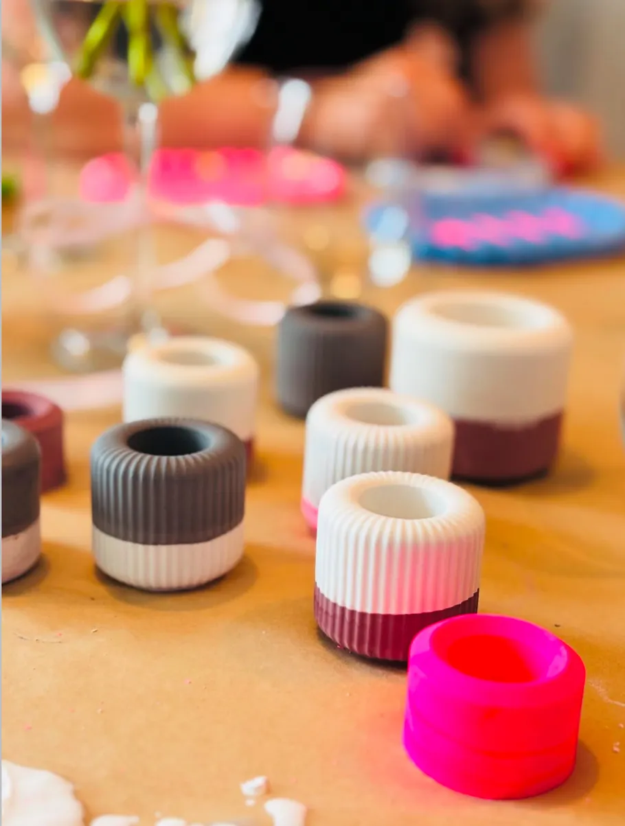 Colorful silicone molds on a table, crafting in background.
