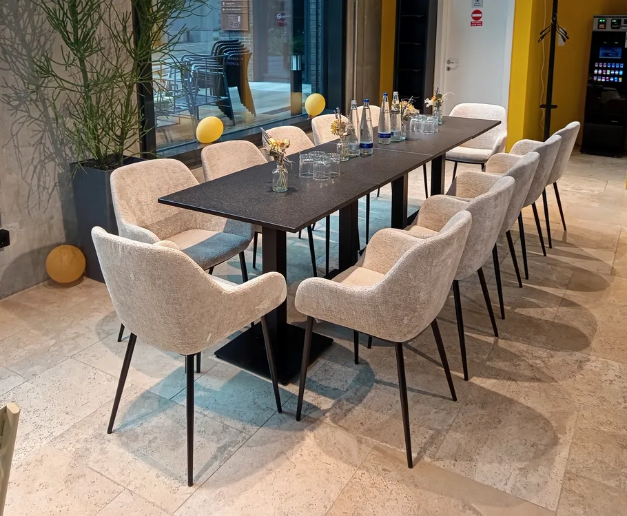 Modern dining table with chairs, indoor setting.