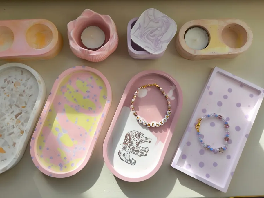 Colorful trays and candles on a table.