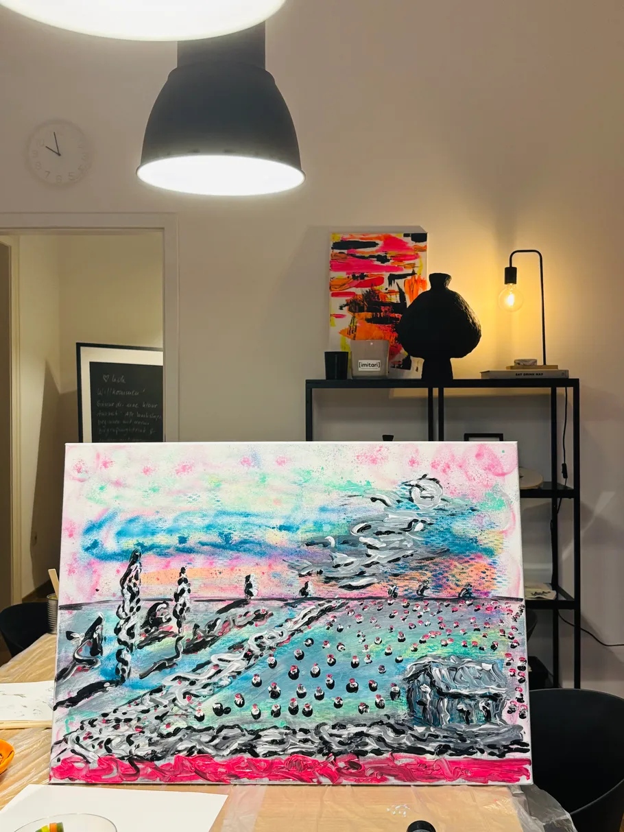 Colorful abstract painting on table indoors.