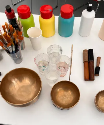 Art supplies on a white table.