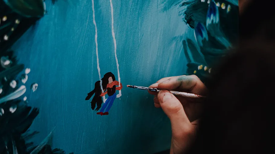Hand painting swing on a blue canvas.